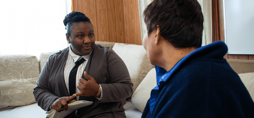 two people talking on couch